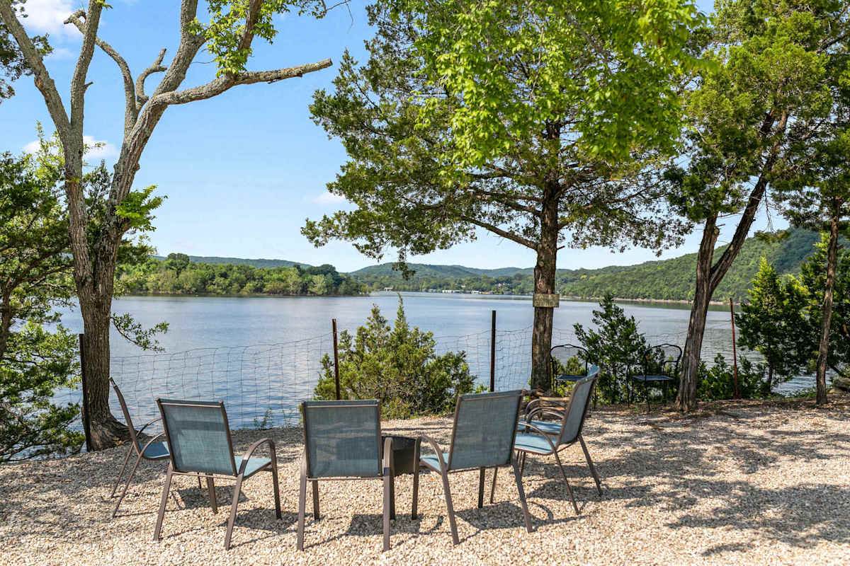 Lakefront seating area with Adirondack chairs